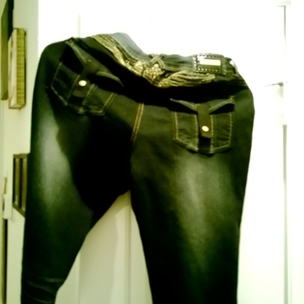 Rocawear women jeans, dark denim with gold trim. Size 11